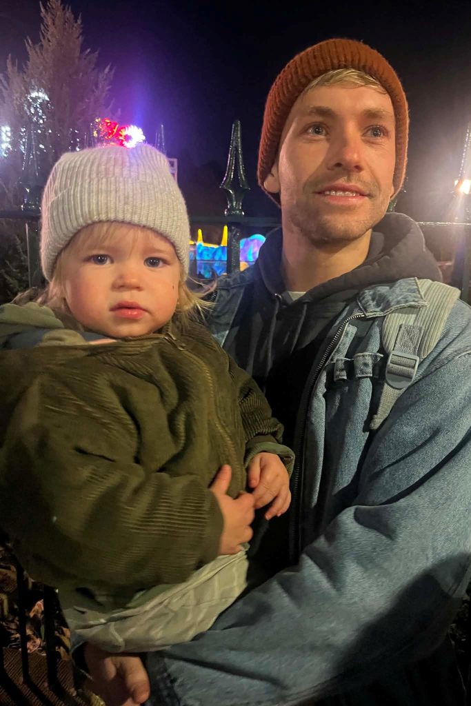 Levi Moss with his son at a community event